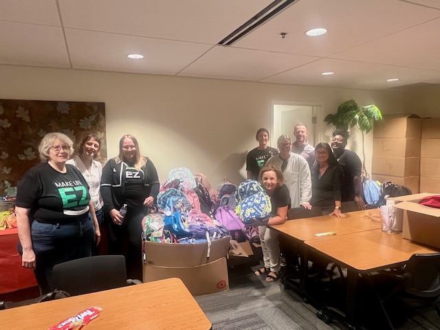HealthEZ employees hosting a school supply drive at PRISM in Golden Valley, MN